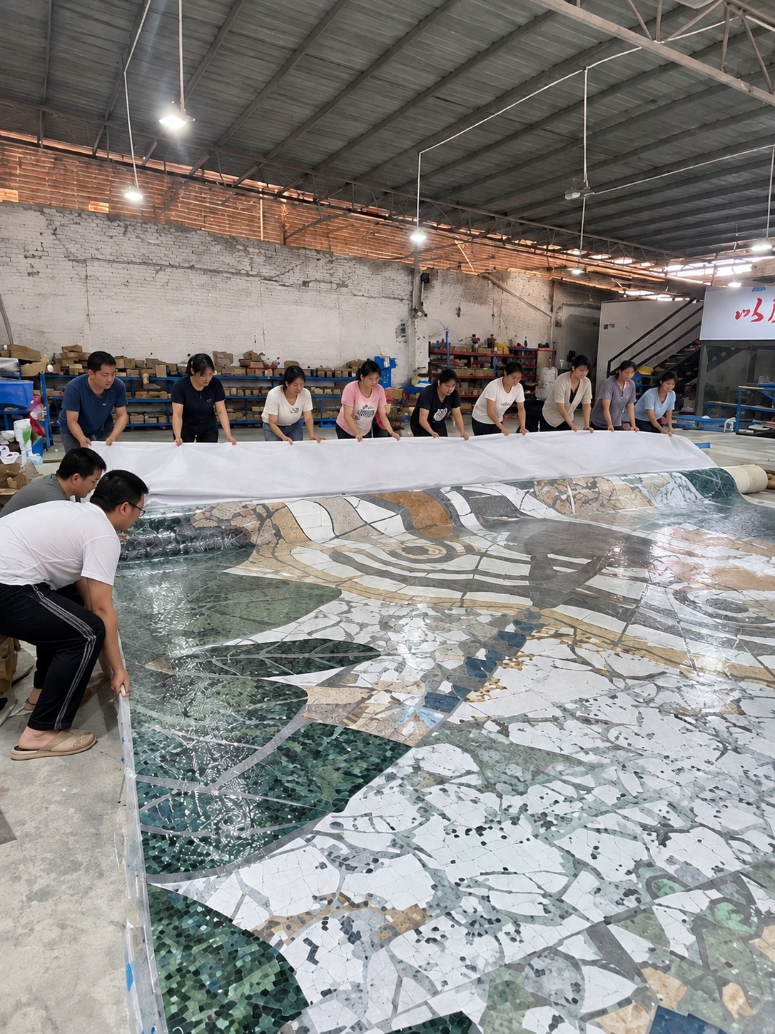 HUITLONG MOSAIC team assembling a large-scale mosaic artwork together