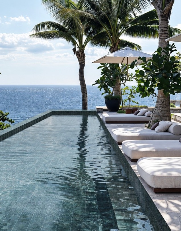 Stone-look ceramic mosaic resort pool application with sun loungers